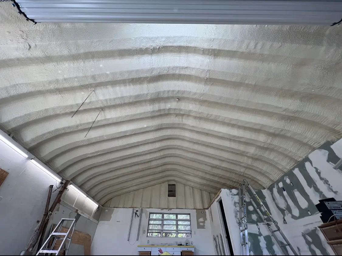 Spray polyurethane foam applied to the underside of a metal roof deck in Lighthouse Point